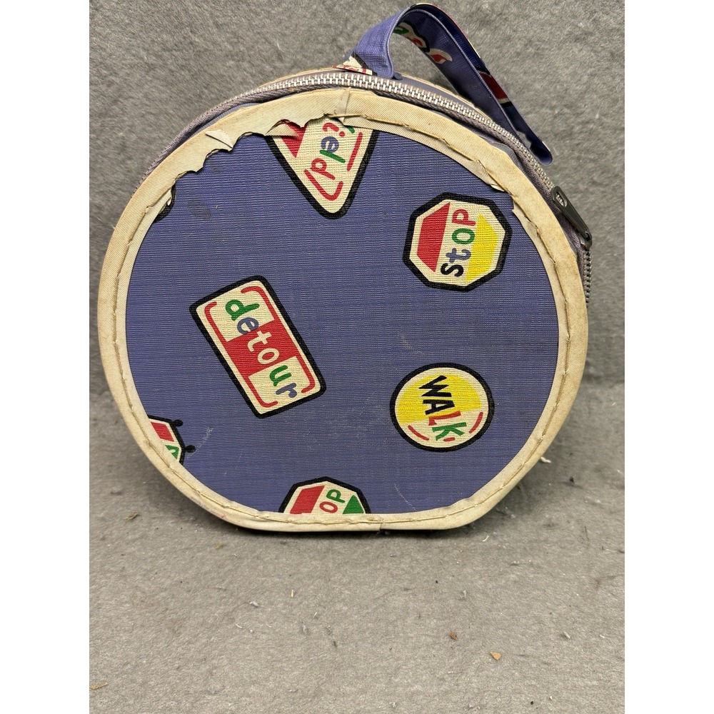 VINTAGE DOLL SUITCASE TRAFFIC SIGN PATTERN W/ MISC. CONTENTS DOLLS, TROLL, BIRDS